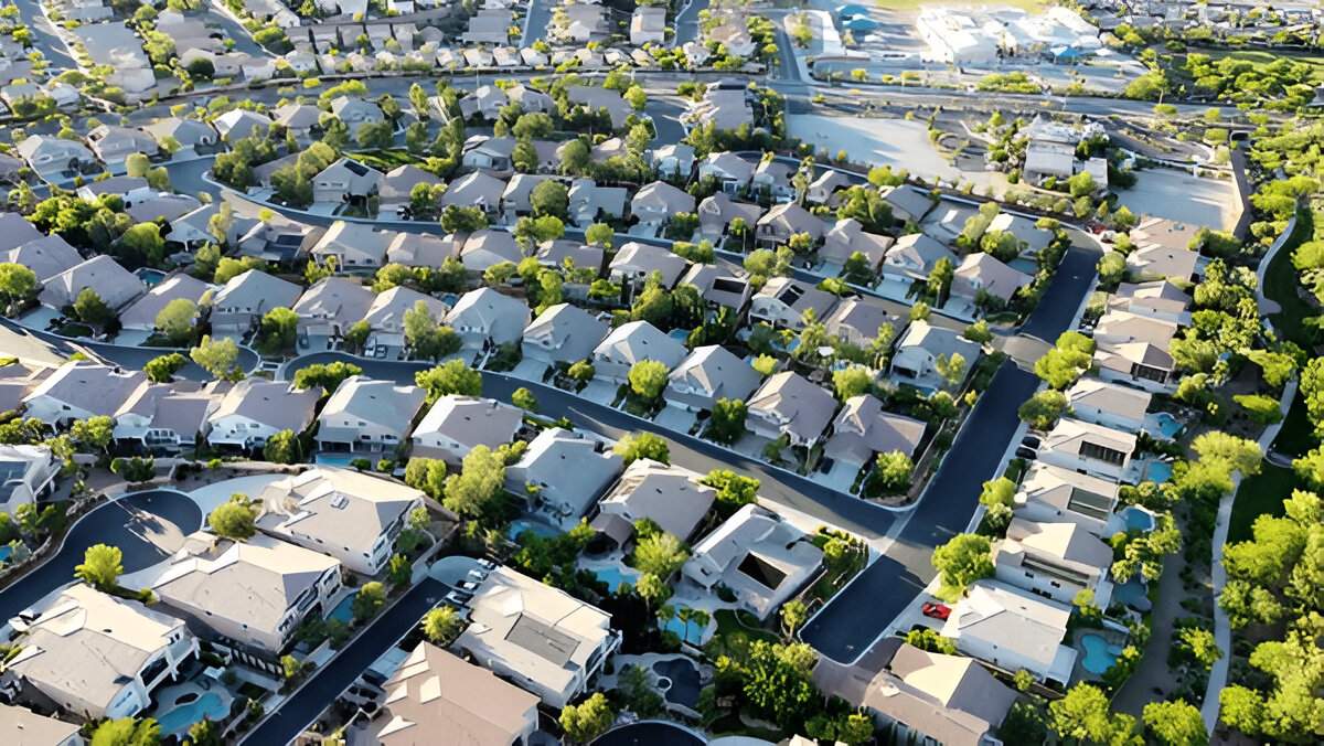 Aerial view of Las Vegas homes with green landscaping and winding streets, showing Sun Valley Landscaping results.
