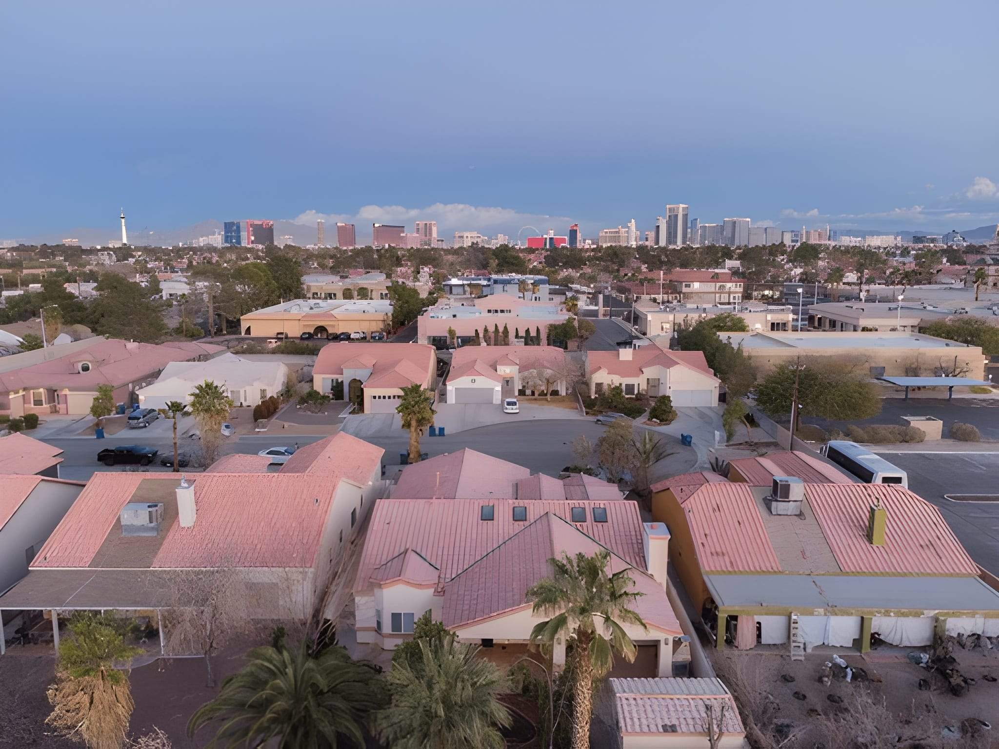 Aerial view of Las Vegas neighborhood with landscaped yards and desert scenery.