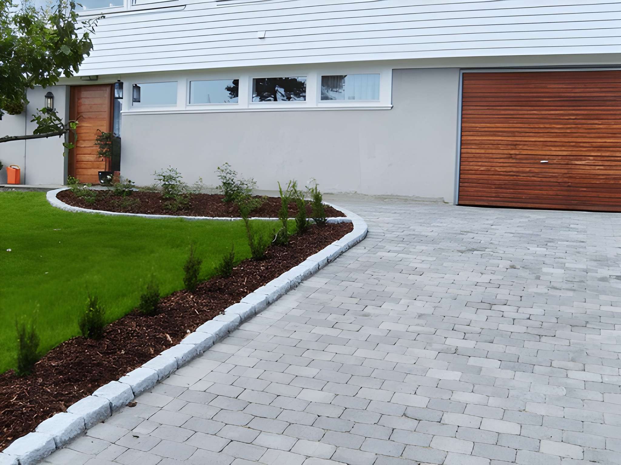 Hardscaping Henderson Curb Appeal Upgrades for Front Yard Design-1 Front yard with clean paver pathway and trimmed greenery, enhancing curb appeal with Sun Valley Landscaping's hardscaping services