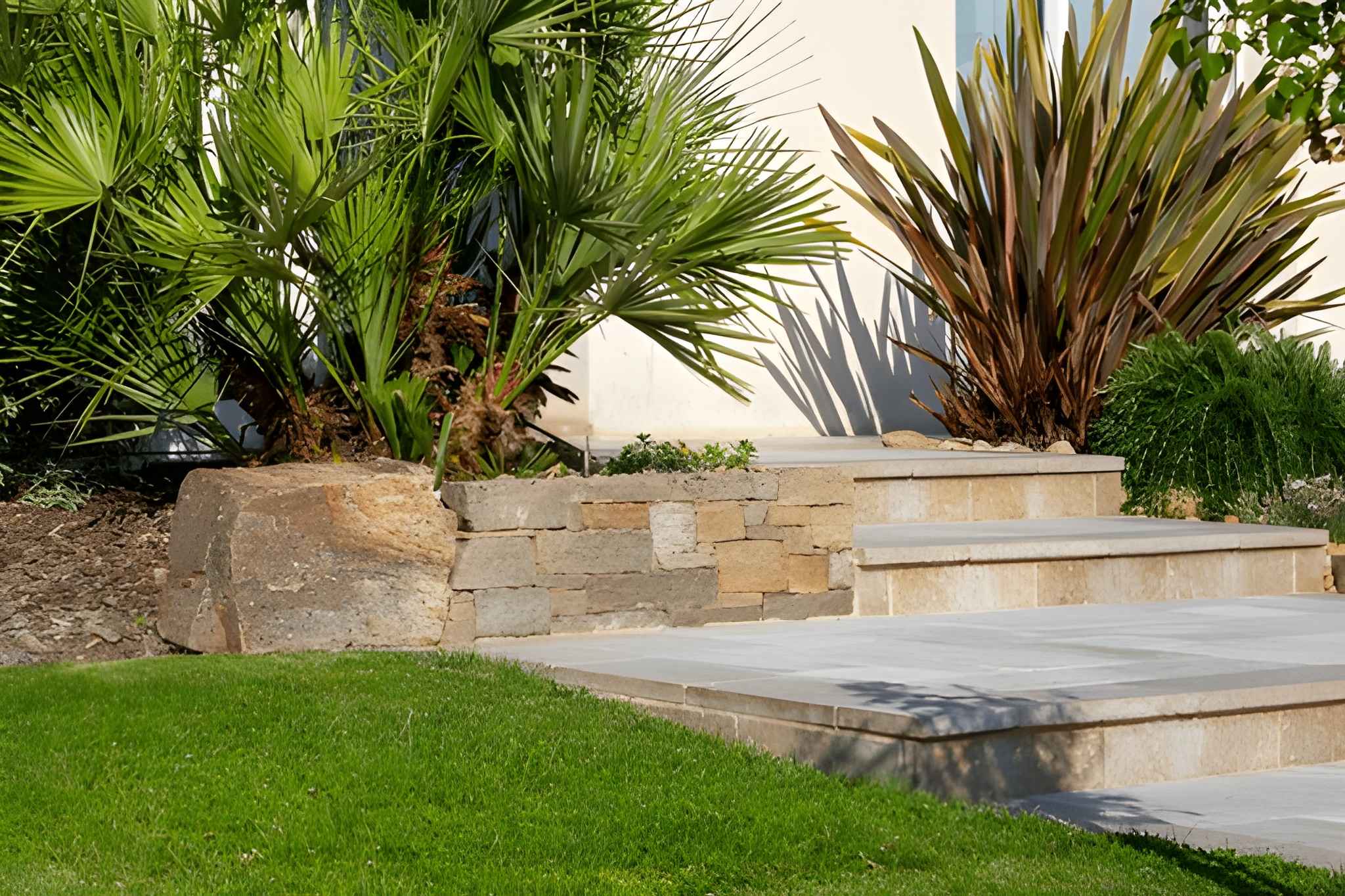 Hardscaping Henderson Curb Appeal Upgrades for Front Yard Design-3 Decorative stone steps and vibrant landscaping plants, crafted by Sun Valley Landscaping for a stylish front yard transformation.